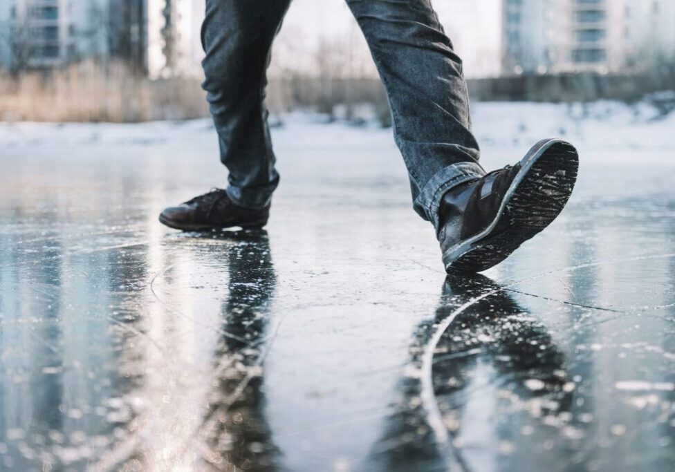 boots slipping on icy sidewalk